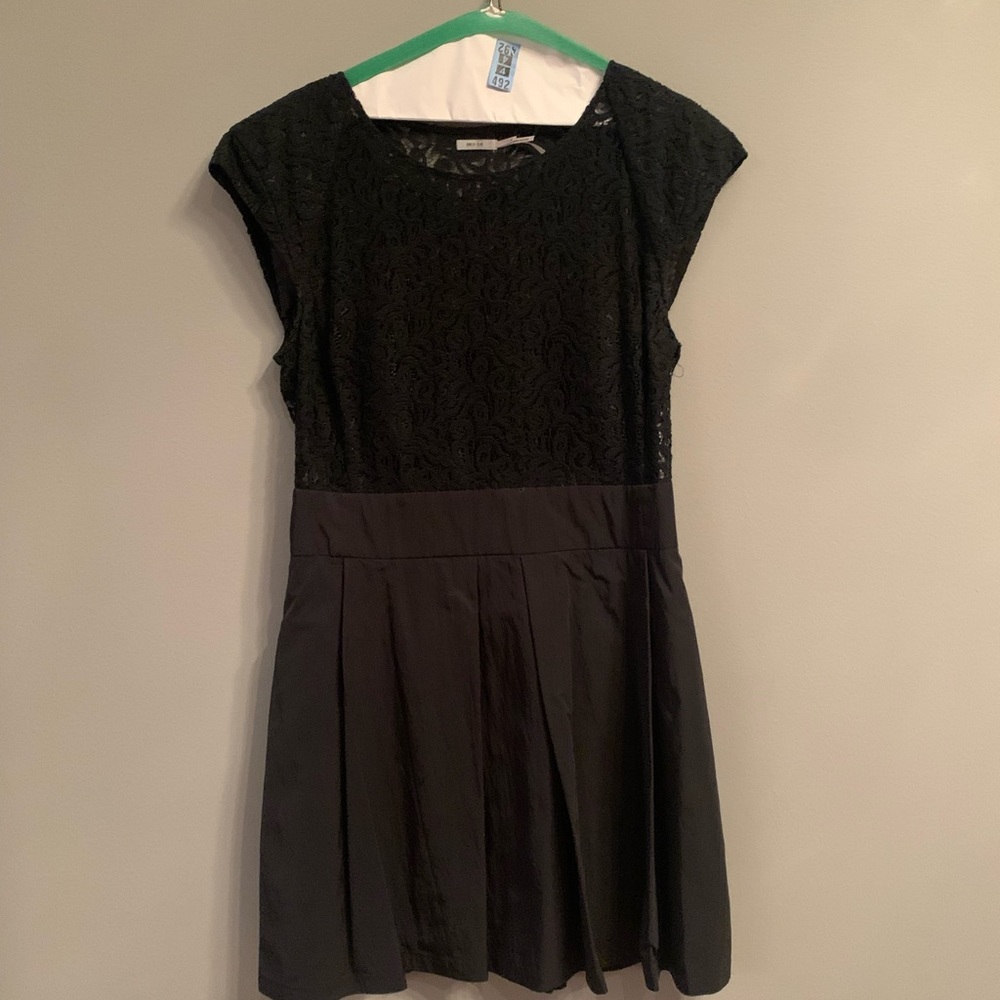 Fit and flare black dress with lace on the top.